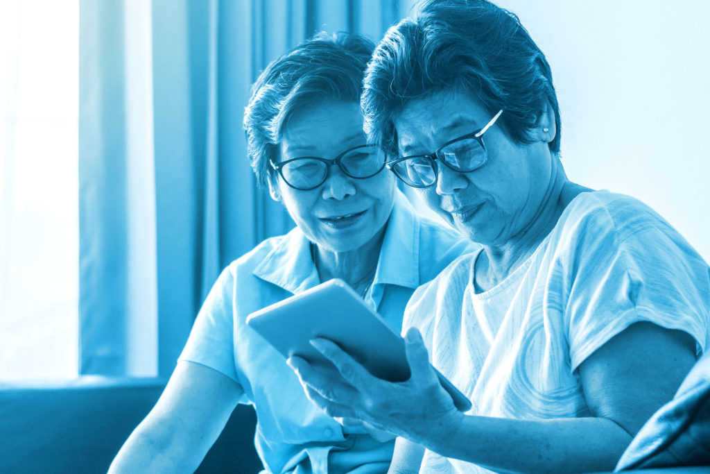 two ladies reading an Ebook